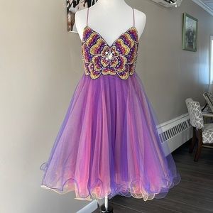 Homecoming dress size 4. Rhinestones on top. Bottom multi-colored. Never altered